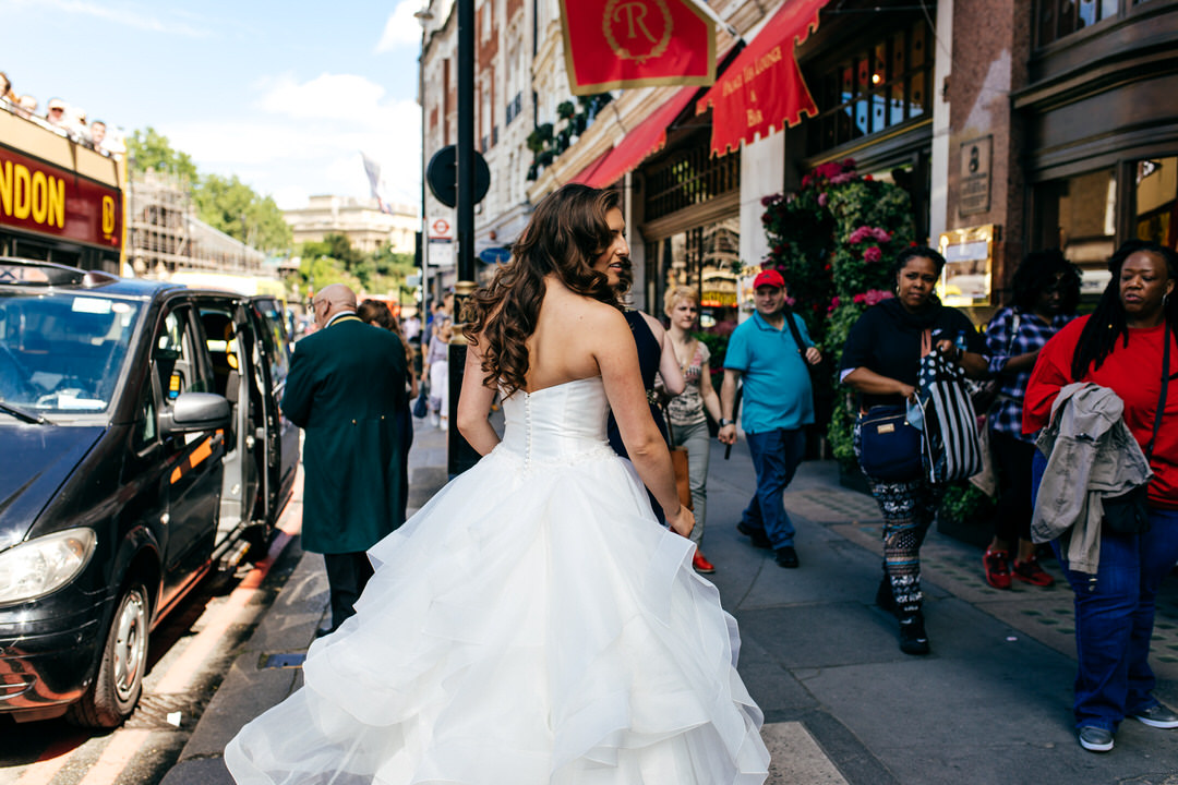 bride-getting-in-cab-full-tulle-skirt-wedding-gown-devonshire-terrace-wedding