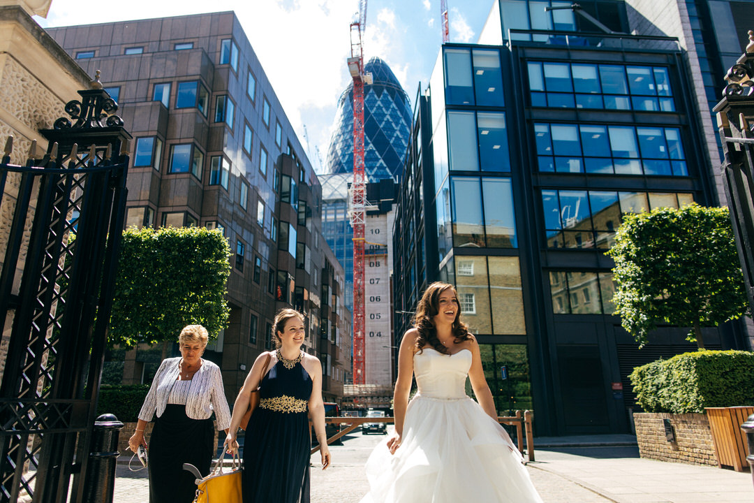 bride-approaches-devonshire-terrace-with-gherkin-behind-london-wedding-photography