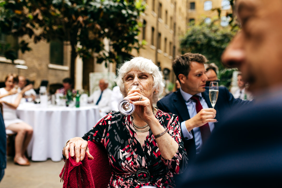 older-lady-guest-drinking-champagne