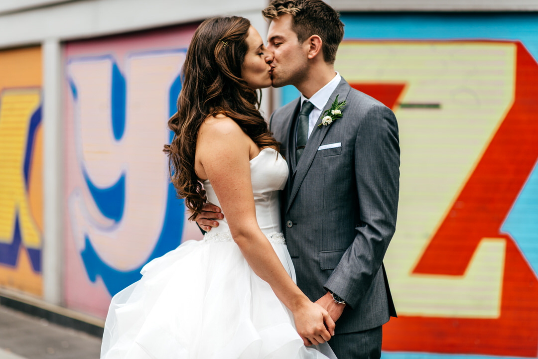 couple-kiss-with-urban-london-backdrop-devonshire-terrace-wedding