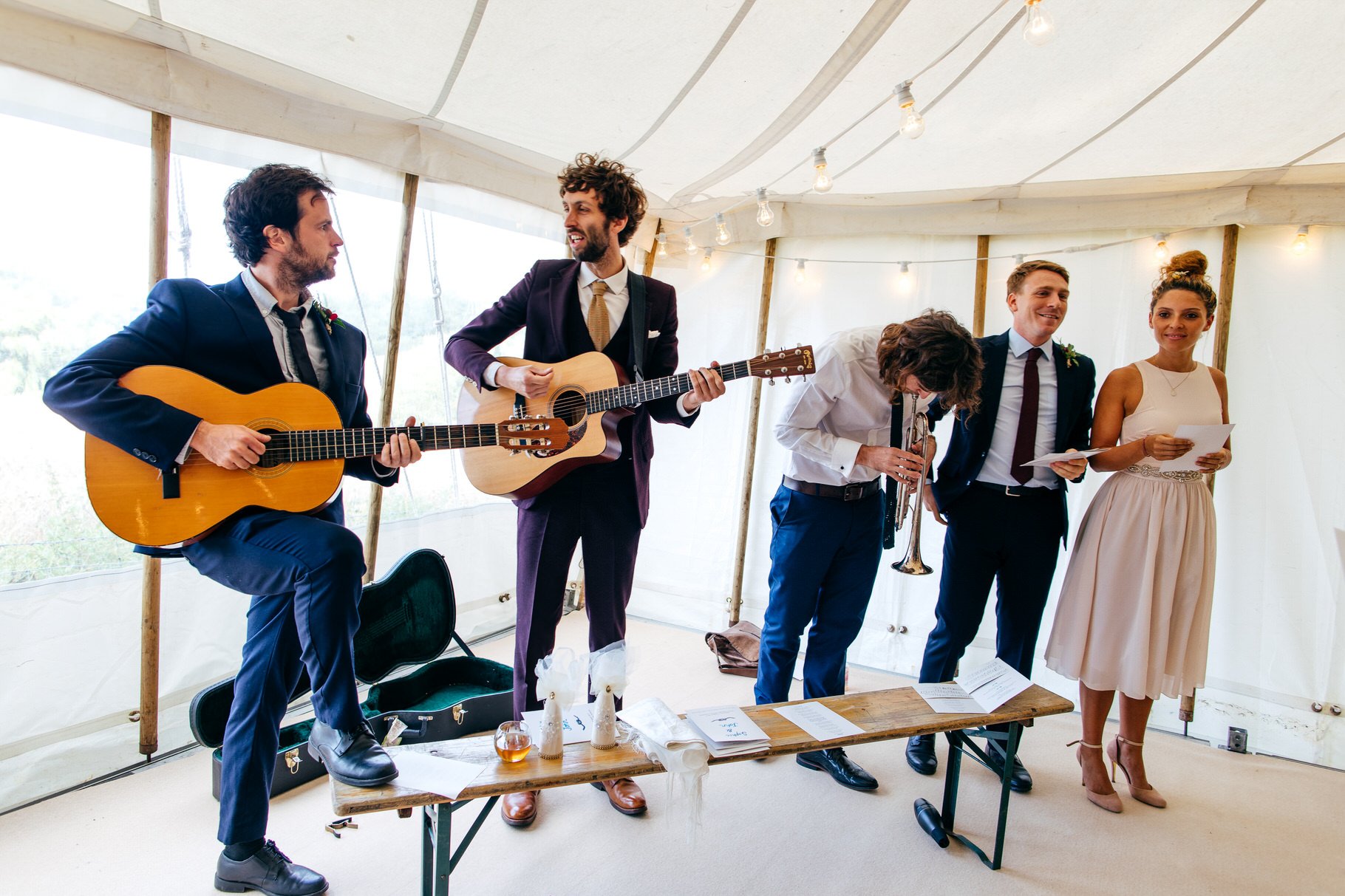 Musicians get ready to play their instruments in wedding tent